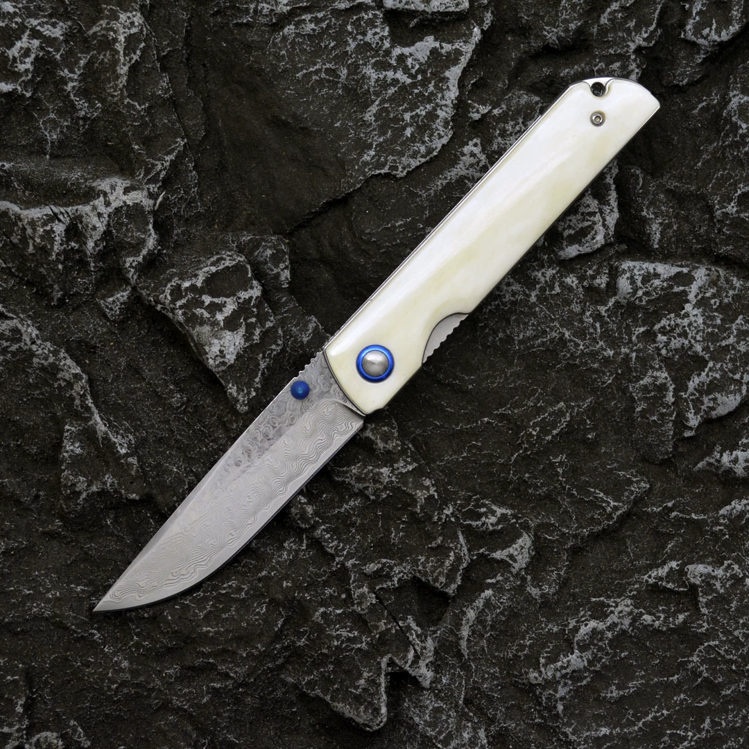 Open bone-handle Damascus folding knife shown from the no-clip side