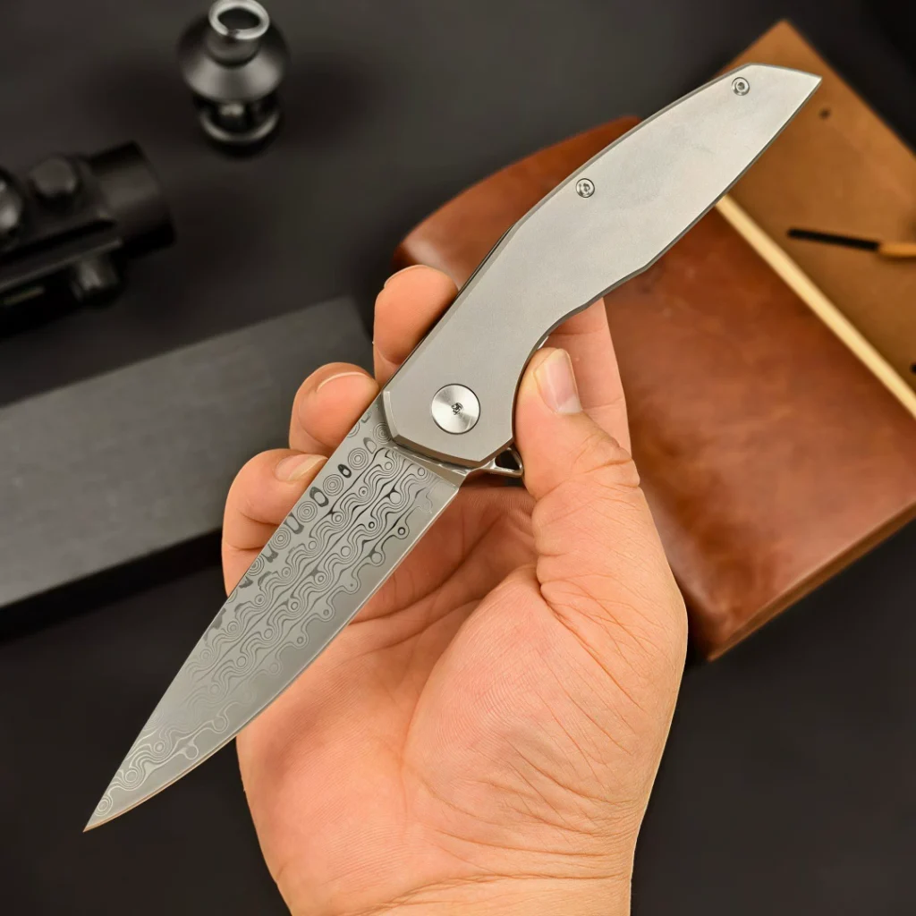 VG10 Damascus steel folding knife shown open